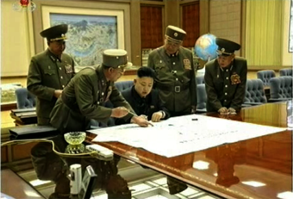 Kim Jong Un in consultation with his generals.