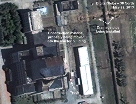 Figure 2. Piping being installed in the drainage ditch. Yongbyon 052213 - 5 MWe Reactor