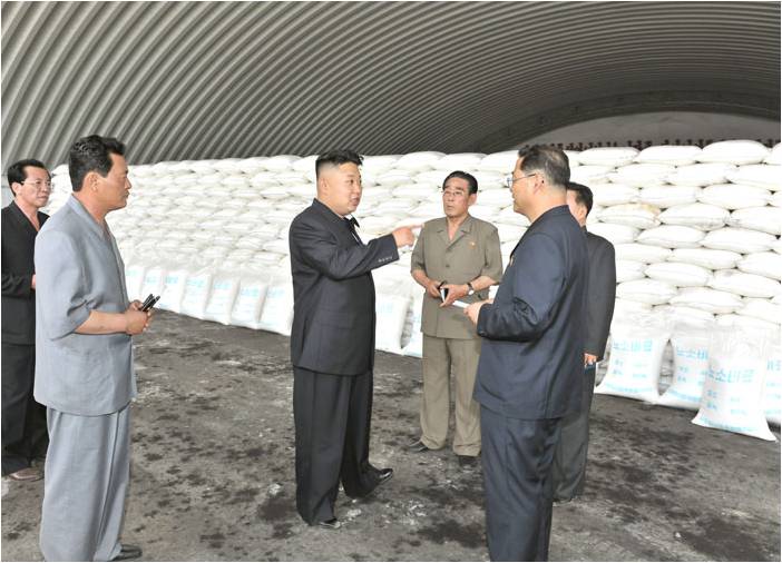 Figure 10. Kim Jong Un inside the urea fertilizer storage building, June 20, 2013.