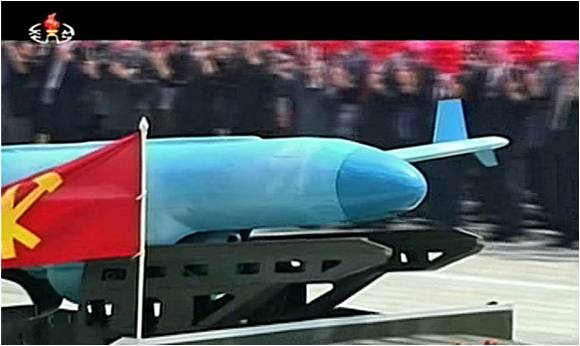 A close-up of the UAV taken during the July 25, 2013 parade showing the gimbaled sensor mount nestle up under the fuselage immediately in front of the engine intake. (Photo: KCTV)