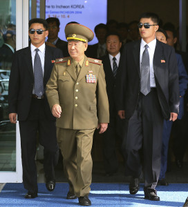 Hwang Pyong So, center left, vice chairman of North Korea’s National Defense Commission, and Choe Ryong Hae, center right, arrive at the Incheon International Airport in South Korea, Saturday, Oct. 4, 2014 to attend the closing ceremony of the Asian Games. (AP Photo/Yonhap, Kim Do-hoon)