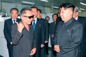 Kim Jong Il and Kim Jong Un offering field guidance.