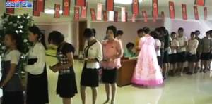 Voters are lined up to cast their ballots at the electoral district No. 117, sub-constituency No. 62, located at the Kim Jong Suk Textile Mill in Songyo district, Pyongyang, on July 19, 2015. Photo: KCTV, DPRK Today. 