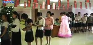Voters are lined up to cast their ballots at the electoral district No. 117, sub-constituency No. 62, located at the Kim Jong Suk Textile Mill in Songyo district, Pyongyang, on July 19, 2015. Photo: KCTV, DPRK Today.