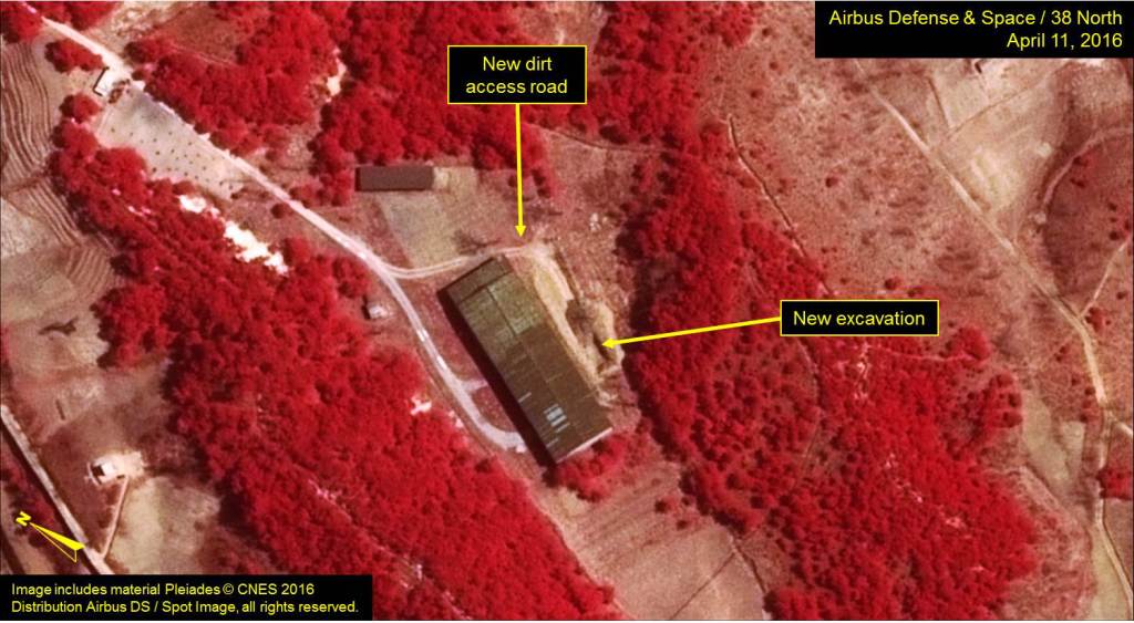 A color infrared image of Building 500. There are indications of surface leakage from the building as most of the vegetation are in shades of red—an indication of health. Damaged or stressed vegetation would appear as dark red, grey or black. Image includes material Pleiades © CNES 2016. Distribution Airbus DS / Spot Image, all rights reserved. For media licensing options, please contact thirtyeightnorth@gmail.com.