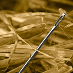 Closeup of a Metal Needle In A Haystack