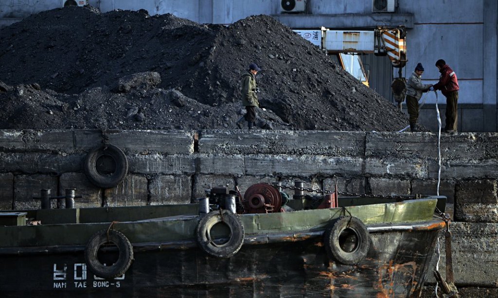 North Korean laborers work beside the Yalu River in Sinuiju, North Korea, near the Chinese city of Dandong. 