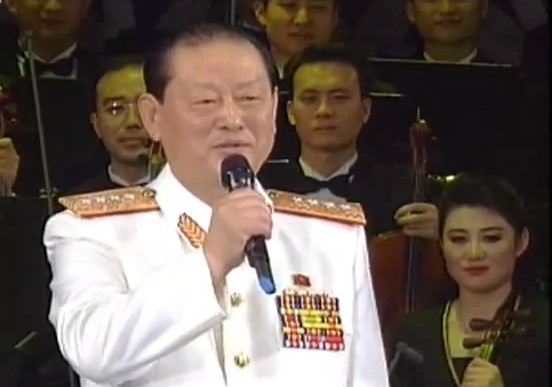 Kim Won Hong performs a duet of “Fascination and Admiration” with his wife during a 2012 concert to mark International Women’s Day (Photo: KCTV/NK Leadership Watch)