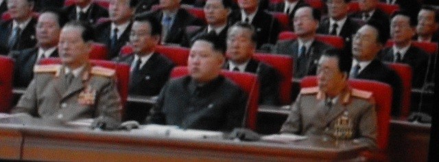 Kim Jong Un at his first major public introduction at the 3rd Party Conference on September 28, 2010. Kim Won Hong is on Jong Un’s left and retired senior KPA official Hyon Chol Hae is on his right (Photo: Korean Central Television)